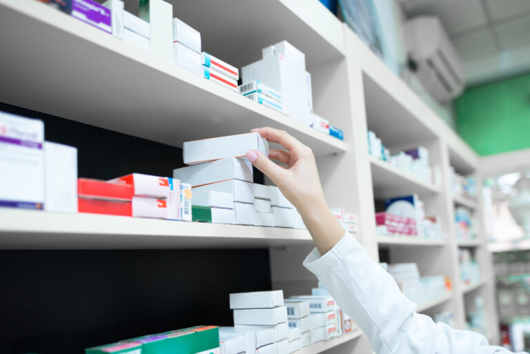 pharmacist retrieving medication