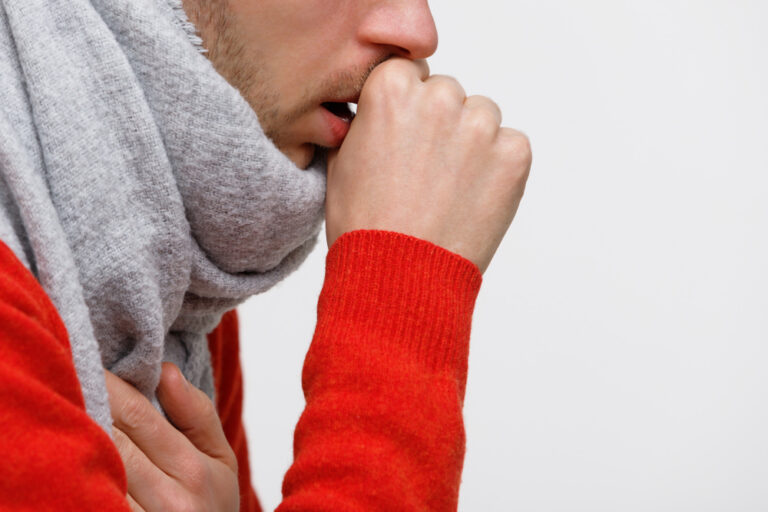 man coughing